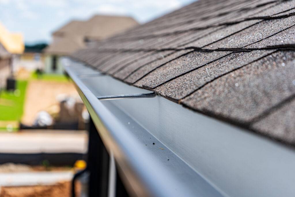 Newly installed metal gutter on home